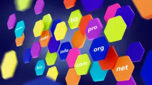 Colorful floating hexagonal tiles displaying domain suffixes such as biz, edu, info, org, com, net